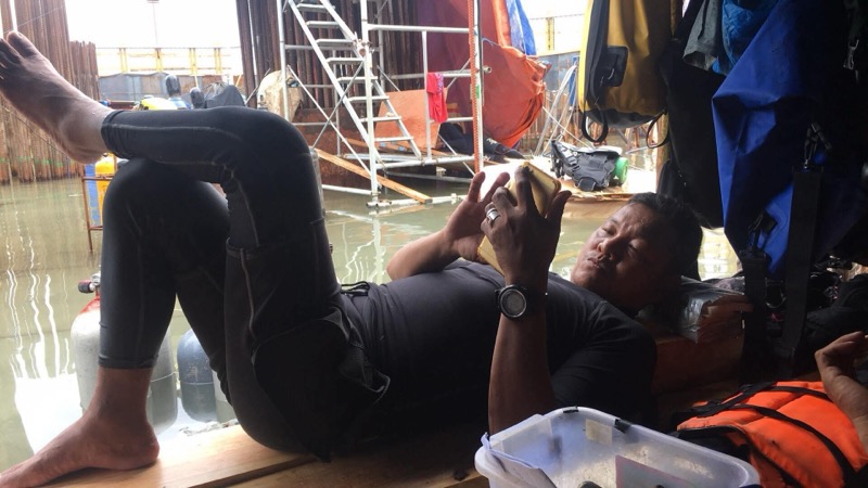 Candid crew downtime moment on site